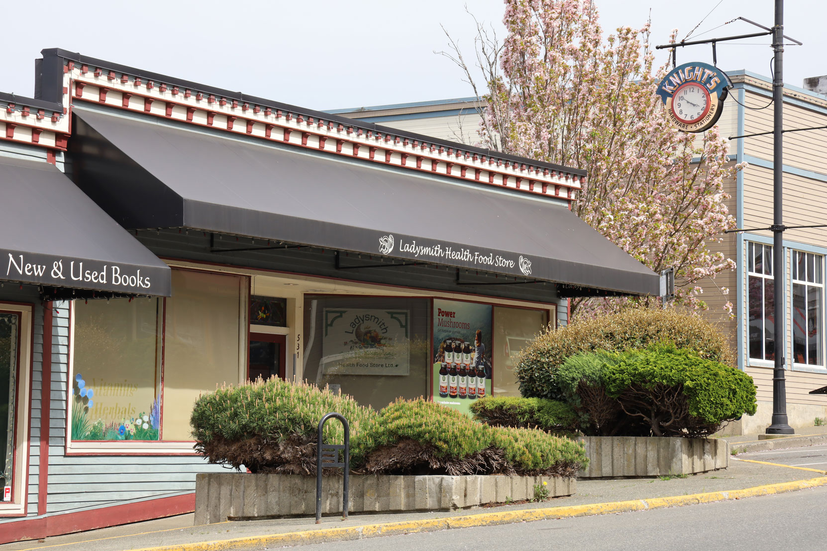 541 1st Avenue in downtown Ladysmith is one of four store fronts in a building originally built in 1945. The Knight's Clock (right) is mounted outside 531 1st Avenue.